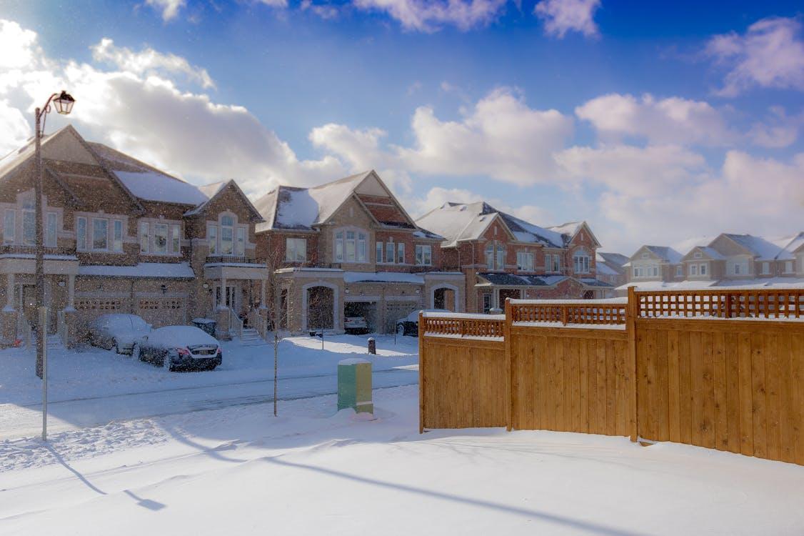 Wooden fence in snow 