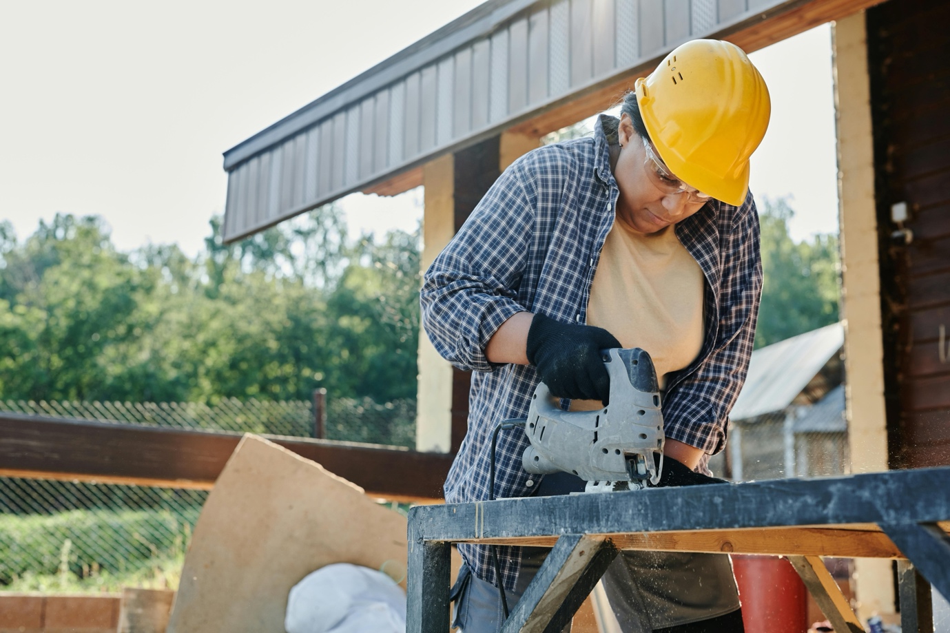 Team of professional installers aligning wooden fence posts in Winslow Township