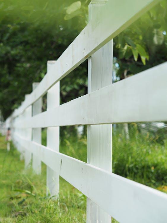 Professional fence installation in Harrison Township, white wooden fence