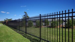 A black aluminum fence