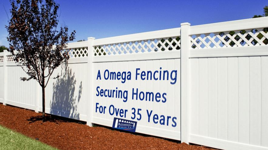 Branding for A Omega Fence Company on a white Vinyl fence