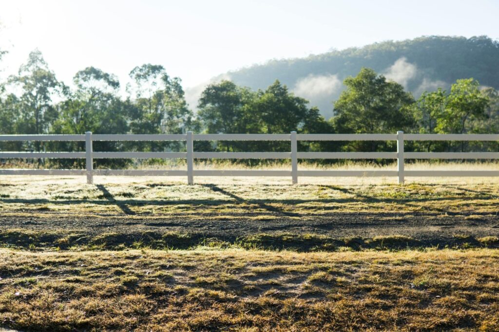 A wooden fence on a field