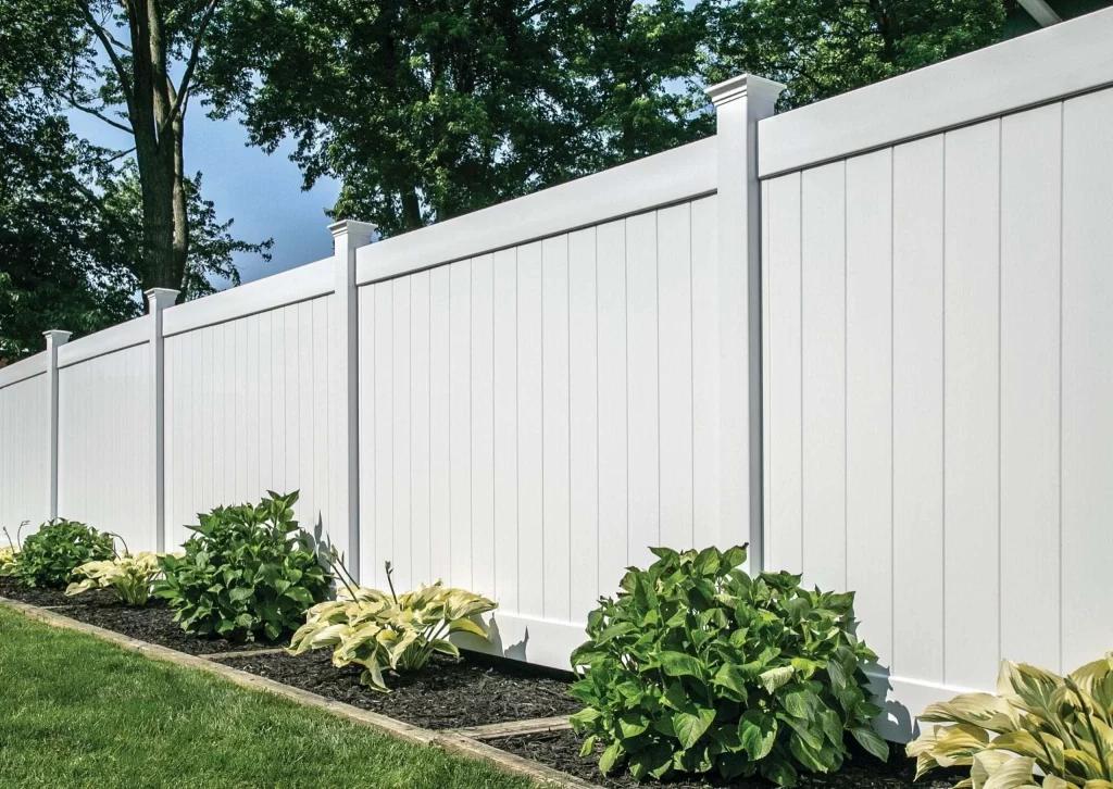 A white vinyl fence