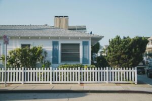 A white fence outside a house