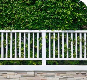A white vinyl fence