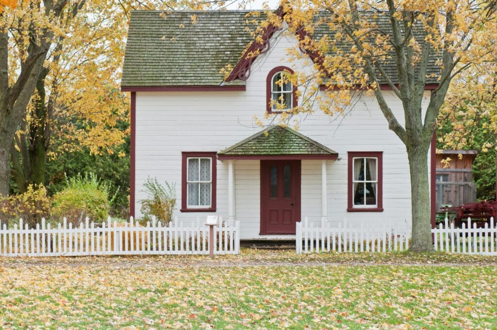 a wooden house with fence